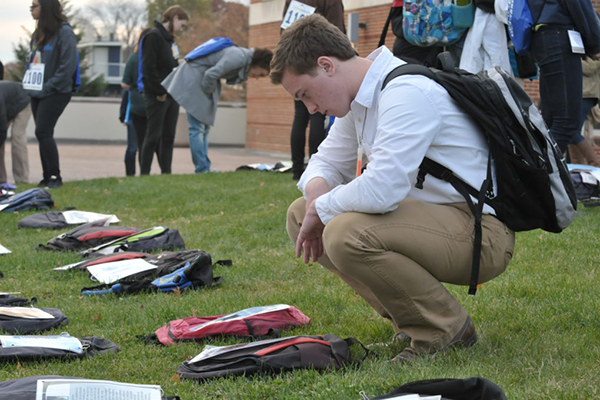 student at send silence packing display