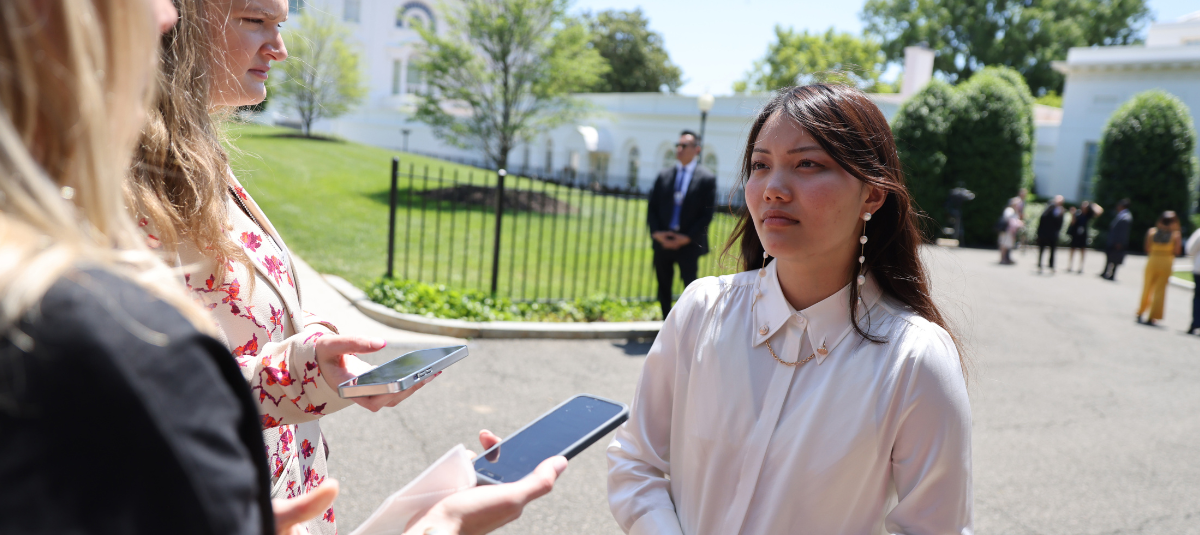 Diana Chao speaking to reporters outside the White House.